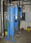 Used Kobelco KNW Series Two Stage Oil Free Rotary Screw Compressor, Model KNW A0-B/H. Air cooled. Rated approximately 223 cfm at 150 psig. Driven by a 60 hp motor. Enclosed in a sound dampening cabin...