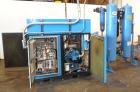 Used Kobelco KNW Series Two Stage Oil Free Rotary Screw Compressor, Model KNW A0-B/H. Air cooled. Rated approximately 223 cfm at 150 psig. Driven by a 60 hp motor. Enclosed in a sound dampening cabin...