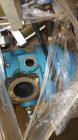 Used Kobelco KNW Series Two Stage Oil Free Rotary Screw Compressor, Model KNW A0-B/H. Air cooled. Rated approximately 223 cfm at 150 psig. Driven by a 60 hp motor. Enclosed in a sound dampening cabin...