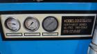 Used Kobelco KNW Series Two Stage Oil Free Rotary Screw Compressor, Model KNW A0-B/H. Air cooled. Rated approximately 223 cfm at 150 psig. Driven by a 60 hp motor. Enclosed in a sound dampening cabin...