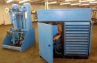 Used Kobelco KNW Series Two Stage Oil Free Rotary Screw Compressor, Model KNW A0-B/H. Air cooled. Rated approximately 223 cfm at 150 psig. Driven by a 60 hp motor. Enclosed in a sound dampening cabin...
