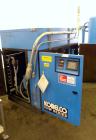 Used Kobelco KNW Series Two Stage Oil Free Rotary Screw Compressor, Model KNW A0-B/H. Air cooled. Rated approximately 223 cfm at 150 psig. Driven by a 60 hp motor. Enclosed in a sound dampening cabin...