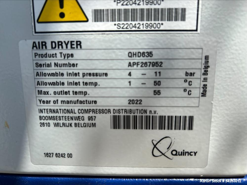 Used Quincy QHD635 twin-tower heatless desiccant air dryer system, manufactured in 2022, complete with integrated control cubicle and pre-/post-filtration assemblies. The unit includes two vertical d...