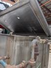 Used Jacketed Double Spiral Ribbon Blender / Chocolate Melter, 304 Stainless Steel. Approximate 40 Cubic Feet working capacity. Jacketed trough approximately 36