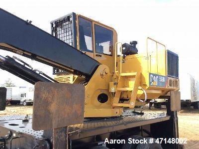 Used Cat 559B Knuckleboom Loader. Grapple: 5055TW-R50.  Delimber: CTR426. Trailer: Evans D-48-HD. Hours 4255.