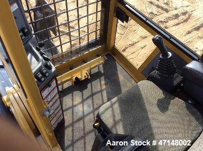 Used Cat 559B Knuckleboom Loader. Grapple: 5055TW-R50.  Delimber: CTR426. Trailer: Evans D-48-HD. Hours 4255.