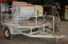 USED: Sprayforce fireproofing/plaster finishing machine, model Calibur. Includes a Wisconsin gas powered engine mixer and a gas powered pump. Unitized on a trailer. Built 1989.