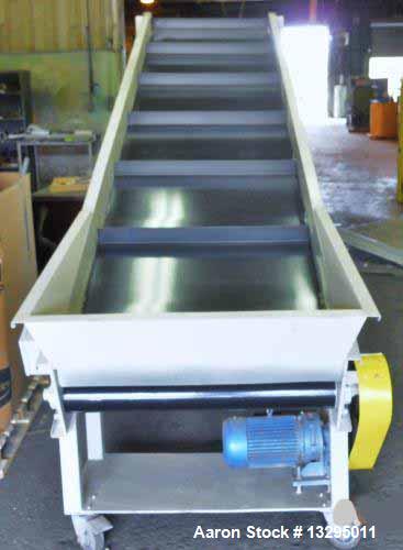 Used- One 36" wide x 13' long conveyor with bottom hopper. Painted with new cleated belt. On casters with adjustable legs.