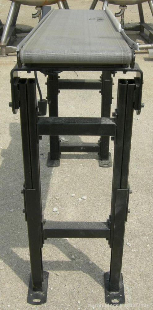 Used Dorner incline belt conveyor, series 2100. Model 2100-1004-05/04. 10" wide x 48" long cloth belt, driven by a 1/2hp, 3/60/208-230/460 volt, 1725 rpm gearmotor, ratio 5 to 1. Mounted on an adjust...