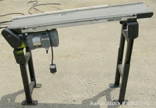 Used Dorner incline belt conveyor, series 2100. Model 2100-1004-05/04. 10" wide x 48" long cloth belt, driven by a 1/2hp, 3/60/208-230/460 volt, 1725 rpm gearmotor, ratio 5 to 1. Mounted on an adjust...