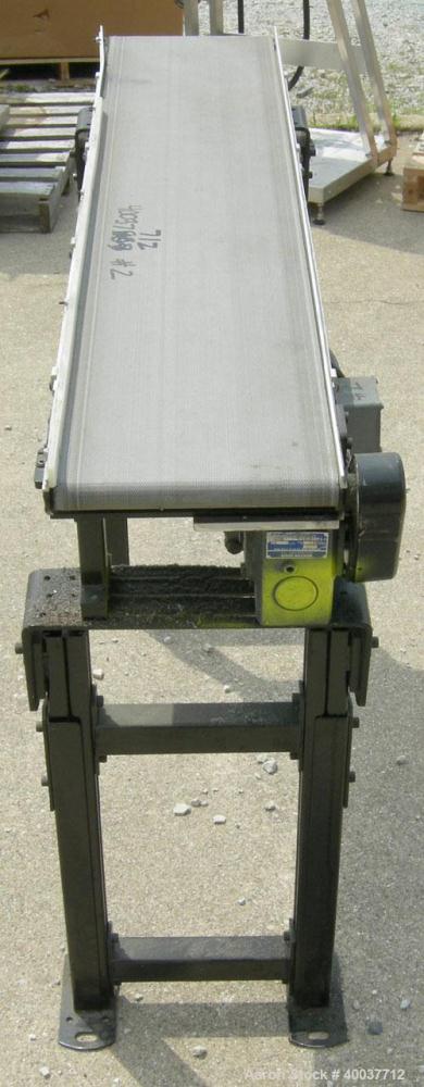 Used Dorner incline belt conveyor, series 2100. Model 2100-1004-05/04. 10" wide x 48" long cloth belt, driven by a 1/2hp, 3/60/208-230/460 volt, 1725 rpm gearmotor, ratio 5 to 1. Mounted on an adjust...