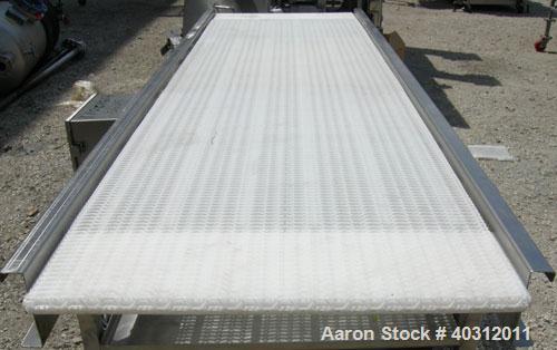 Used Belt Conveyor, 29" wide x 102" long plastic belt. Driven by a 1/2 hp, 3/60/230/460 volt, 1725 rpm motor with an Allen Bradley Powerflex 4 panel. Mounted on a 304 stainless steel frame with caste...