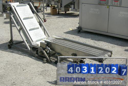 Used Inclined "S" shaped conveyor, 304 stainless steel frame. 16" wide cleated plastic belt, 12" long bottom infeed section, 42" long incline section, 14" long top discharge section, approximate 40" ...