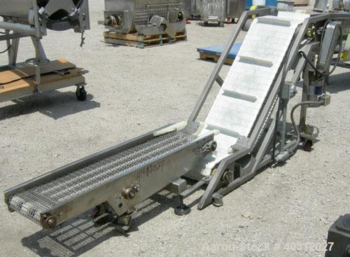 Used Inclined "S" shaped conveyor, 304 stainless steel frame. 16" wide cleated plastic belt, 12" long bottom infeed section, 42" long incline section, 14" long top discharge section, approximate 40" ...