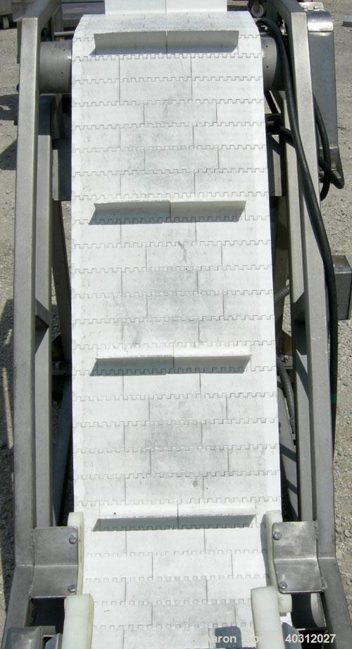 Used Inclined "S" shaped conveyor, 304 stainless steel frame. 16" wide cleated plastic belt, 12" long bottom infeed section, 42" long incline section, 14" long top discharge section, approximate 40" ...