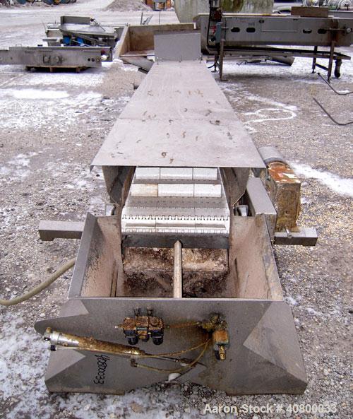 Used Heat and Control Inclined Belt Conveyor. 16" wide x 192" long plastic belt with 2" high pleats. Bottom feed with hopper, end discharge with 2 sided diverter. Driven by a 1 hp, 3/60/575 volt, 172...