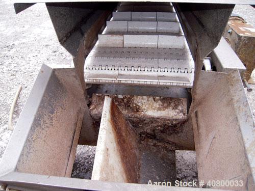Used Heat and Control Inclined Belt Conveyor. 16" wide x 192" long plastic belt with 2" high pleats. Bottom feed with hopper, end discharge with 2 sided diverter. Driven by a 1 hp, 3/60/575 volt, 172...