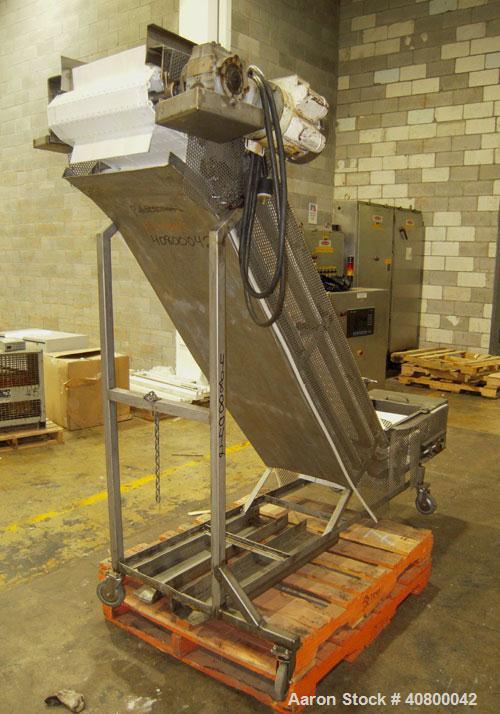 Used Inclined "S" Shaped Conveyor, 304 stainless steel frame. 14" wide x 3" tall cleated plastic belt, 24" long bottom infeed section, 72" long incline section, 12" long top discharge section, approx...