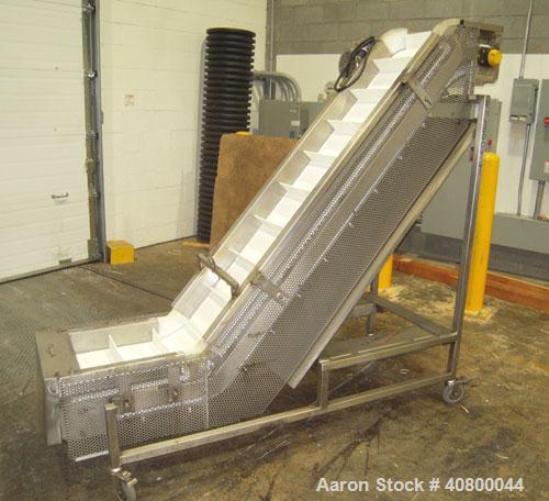 Used Trio-Pac Inclined "S" Shaped Conveyor, 304 stainless steel frame. 14" wide x 3" tall cleated plastic belt, 24" long bottom infeed section, 72" long incline section, 12" long top discharge sectio...
