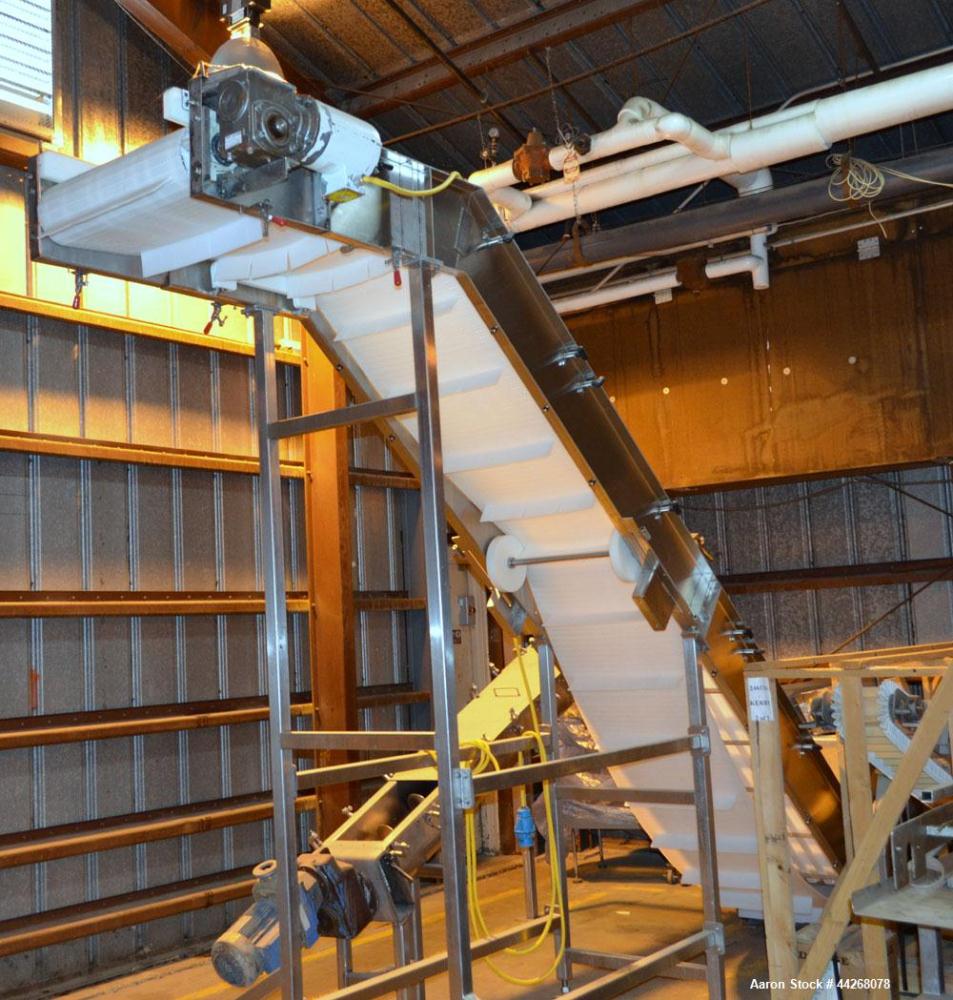 Used Inclined Belt Conveyor.  Belt;  24" wide x 13 long incline section, 48" bottom section, 36" top section.  112" discharge height.  End feed hopper, mounted on a Stainless Steel frame with casters...