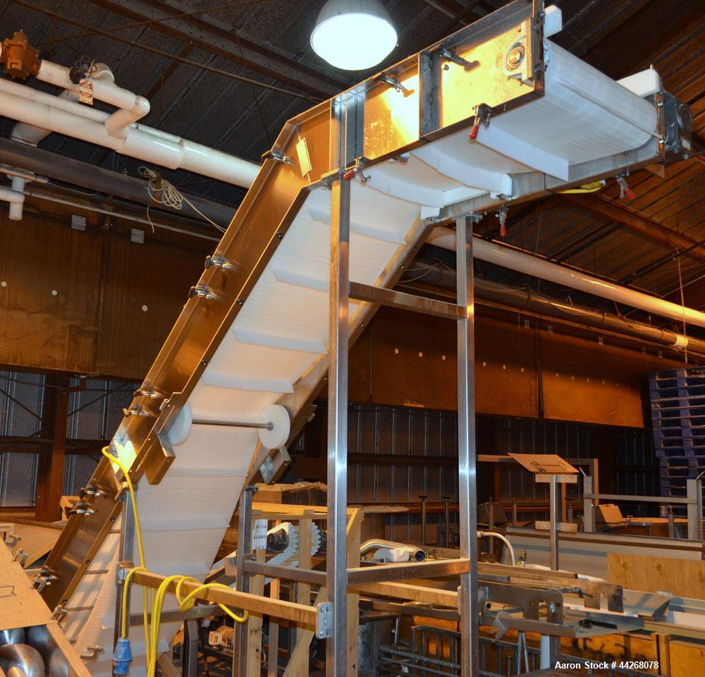 Used Inclined Belt Conveyor.  Belt;  24" wide x 13 long incline section, 48" bottom section, 36" top section.  112" discharge height.  End feed hopper, mounted on a Stainless Steel frame with casters...