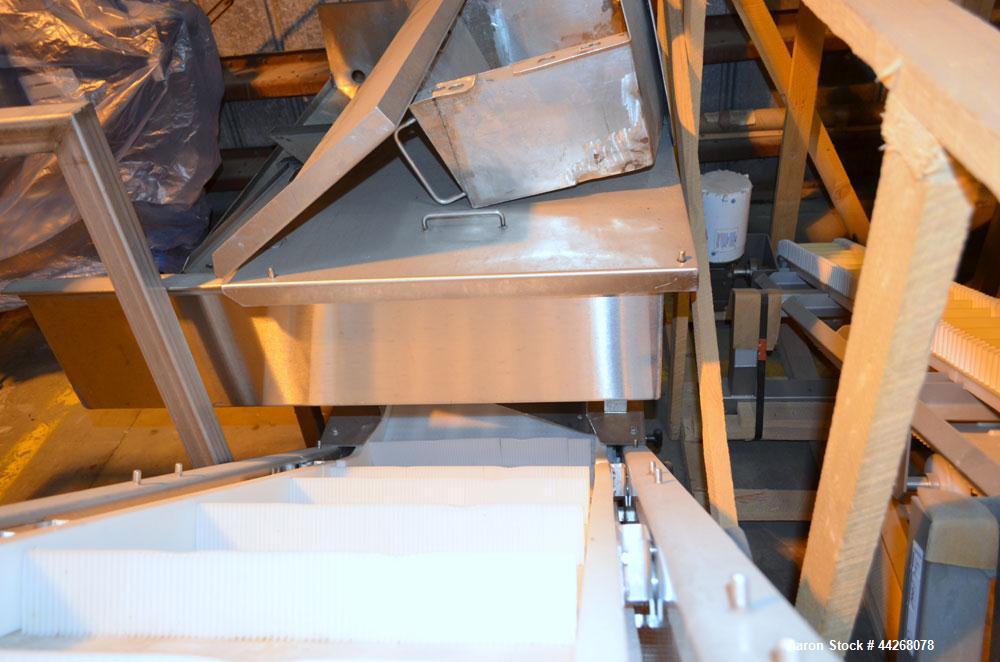 Used Inclined Belt Conveyor.  Belt;  24" wide x 13 long incline section, 48" bottom section, 36" top section.  112" discharge height.  End feed hopper, mounted on a Stainless Steel frame with casters...