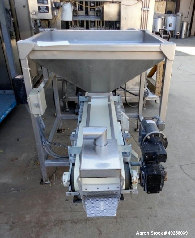 Used Belt infeed conveyor measuring 11" wide x 65" long x 25" high with stainless steel hopper measuring 40" x 40" x 4-1/2" straight side to 19" cone to 8" x 8" discharge. Unit is powered by 1/2 hp, ...