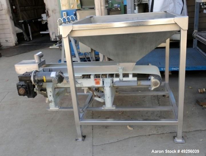 Used Belt infeed conveyor measuring 11" wide x 65" long x 25" high with stainless steel hopper measuring 40" x 40" x 4-1/2" straight side to 19" cone to 8" x 8" discharge. Unit is powered by 1/2 hp, ...