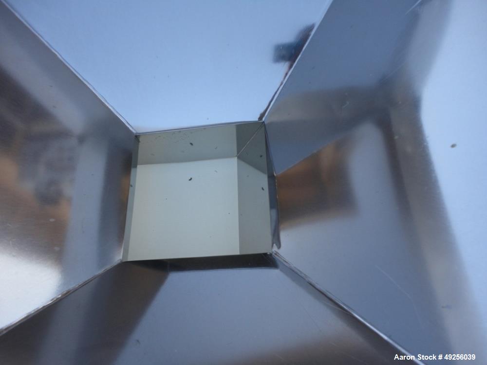Used Belt infeed conveyor measuring 11" wide x 65" long x 25" high with stainless steel hopper measuring 40" x 40" x 4-1/2" straight side to 19" cone to 8" x 8" discharge. Unit is powered by 1/2 hp, ...