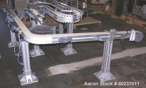Used Autopack Belt Conveyor. 3 1/4" wide x 84" straight section x 1/4 circle left section x 64" straight section. Driven by a 1/2 hp motor with variable speed.