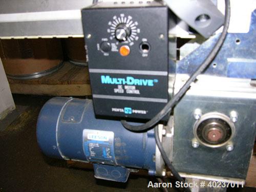 Used Autopack Belt Conveyor. 3 1/4" wide x 84" straight section x 1/4 circle left section x 64" straight section. Driven by a 1/2 hp motor with variable speed.