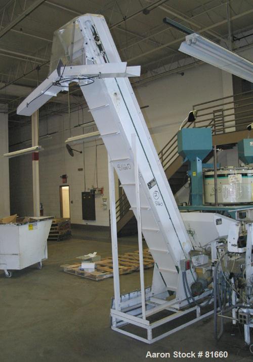 USED: FMC Syntron incline belt conveyor/elevator, model BE-10-6-B, carbon steel. 12" wide x 120" long rubber belt with pleats placed approximately 11-3/4" apart and 2" deep. Approximate 11' discharge...