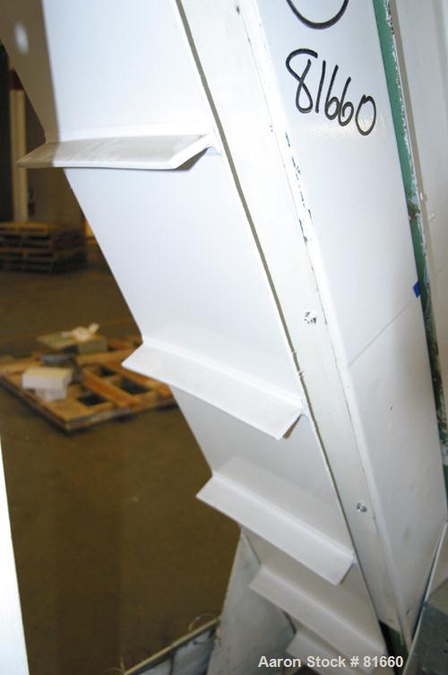 USED: FMC Syntron incline belt conveyor/elevator, model BE-10-6-B, carbon steel. 12" wide x 120" long rubber belt with pleats placed approximately 11-3/4" apart and 2" deep. Approximate 11' discharge...