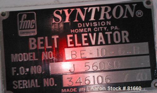 USED: FMC Syntron incline belt conveyor/elevator, model BE-10-6-B, carbon steel. 12" wide x 120" long rubber belt with pleats placed approximately 11-3/4" apart and 2" deep. Approximate 11' discharge...