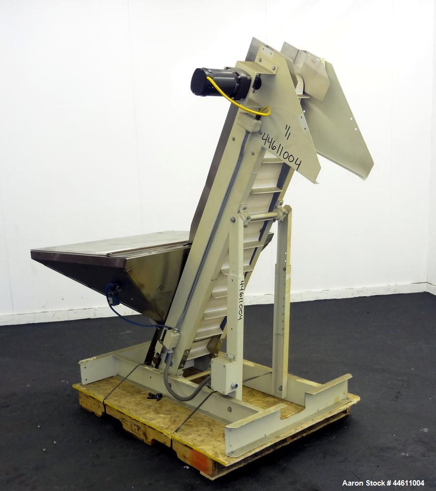 Used Hoppmann Elevating Prefeeder, Model EP, Series 8.  8" Wide rubber belt with 1-3/4" tall pleats placed approximately 6" apart.  Approximately 70" discharge height.  304 Stainless steel 8 cubic fo...