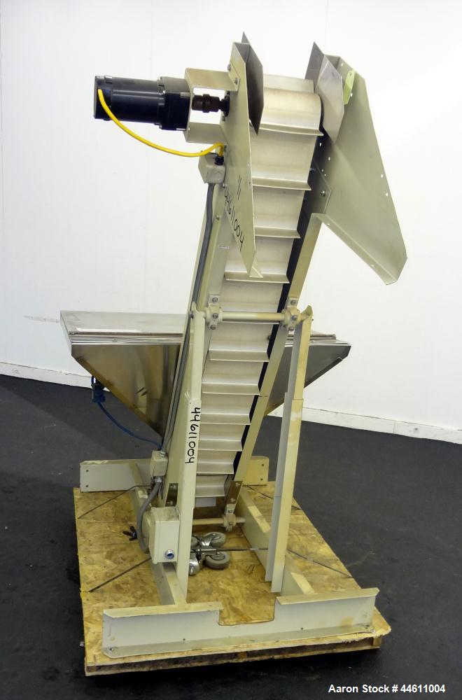 Used Hoppmann Elevating Prefeeder, Model EP, Series 8.  8" Wide rubber belt with 1-3/4" tall pleats placed approximately 6" apart.  Approximately 70" discharge height.  304 Stainless steel 8 cubic fo...
