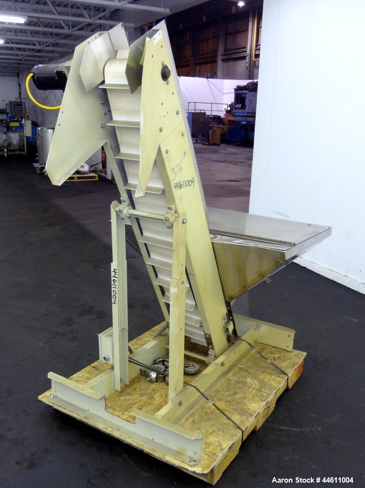 Used Hoppmann Elevating Prefeeder, Model EP, Series 8.  8" Wide rubber belt with 1-3/4" tall pleats placed approximately 6" apart.  Approximately 70" discharge height.  304 Stainless steel 8 cubic fo...