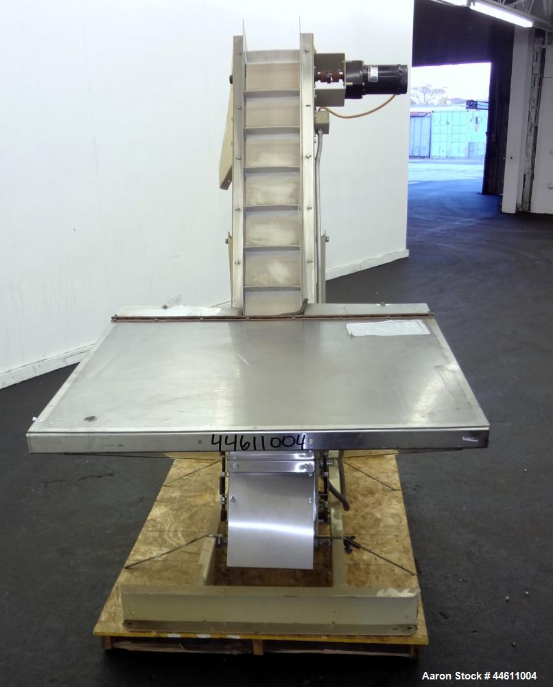 Used Hoppmann Elevating Prefeeder, Model EP, Series 8.  8" Wide rubber belt with 1-3/4" tall pleats placed approximately 6" apart.  Approximately 70" discharge height.  304 Stainless steel 8 cubic fo...