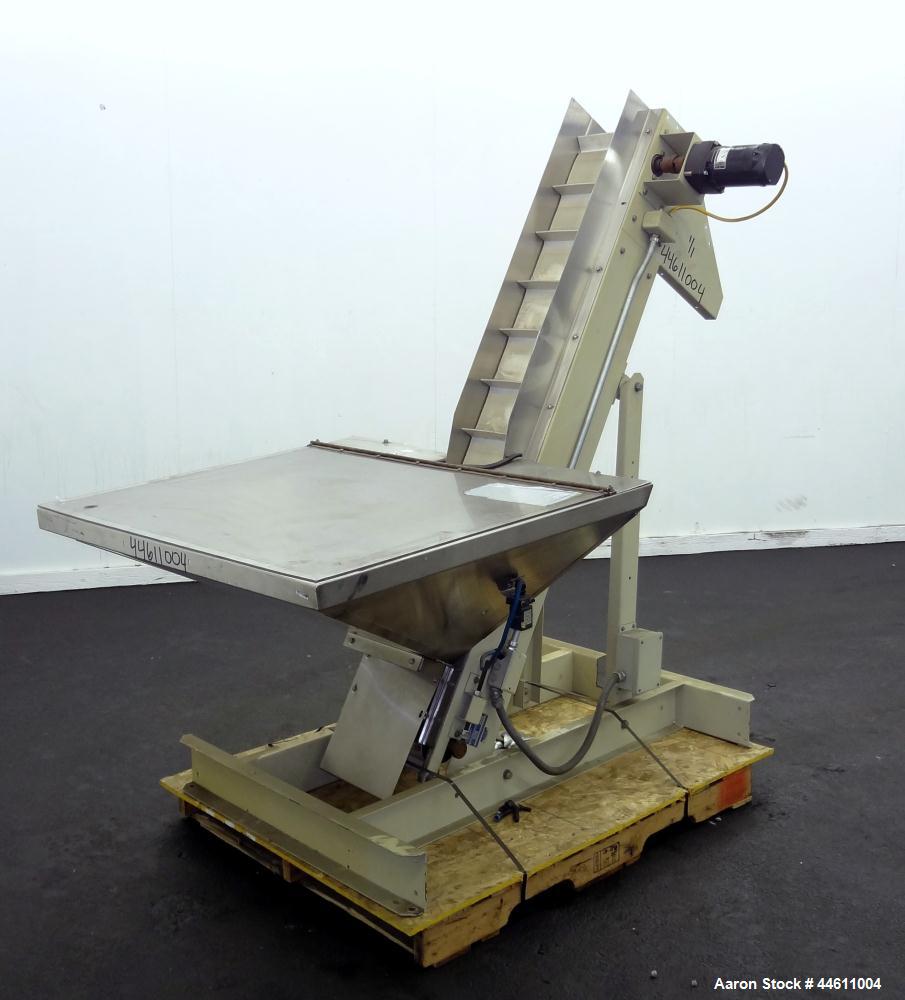 Used Hoppmann Elevating Prefeeder, Model EP, Series 8.  8" Wide rubber belt with 1-3/4" tall pleats placed approximately 6" apart.  Approximately 70" discharge height.  304 Stainless steel 8 cubic fo...