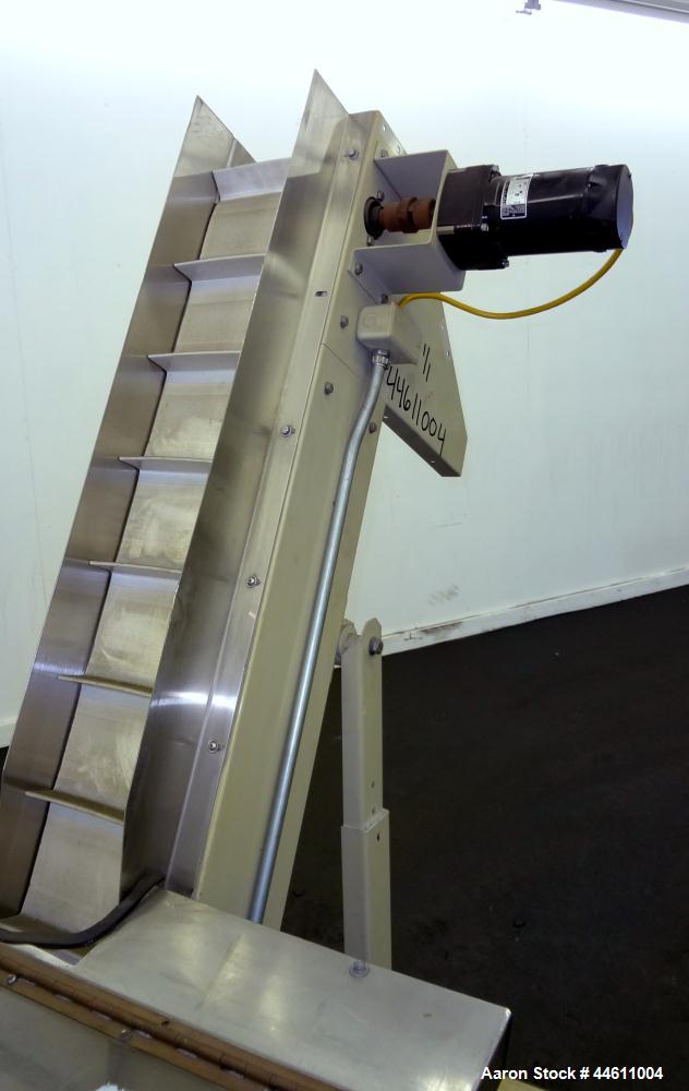 Used Hoppmann Elevating Prefeeder, Model EP, Series 8.  8" Wide rubber belt with 1-3/4" tall pleats placed approximately 6" apart.  Approximately 70" discharge height.  304 Stainless steel 8 cubic fo...