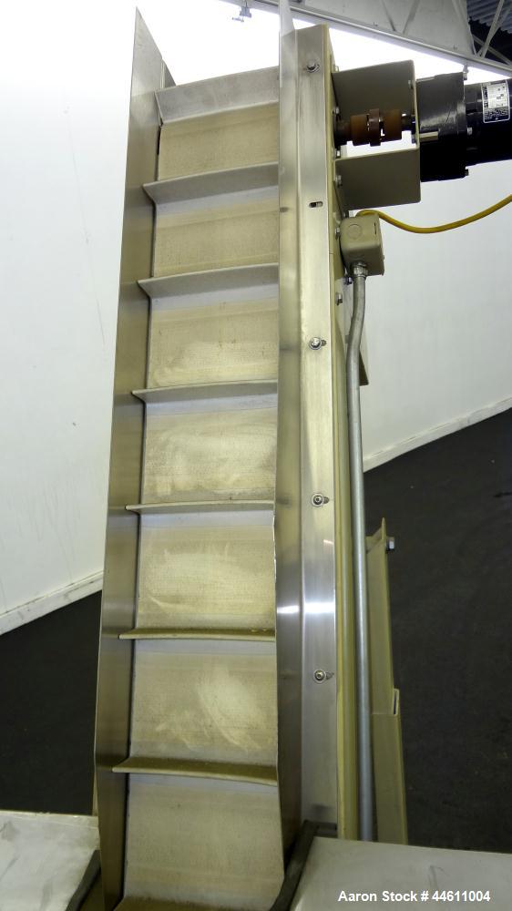 Used Hoppmann Elevating Prefeeder, Model EP, Series 8.  8" Wide rubber belt with 1-3/4" tall pleats placed approximately 6" apart.  Approximately 70" discharge height.  304 Stainless steel 8 cubic fo...