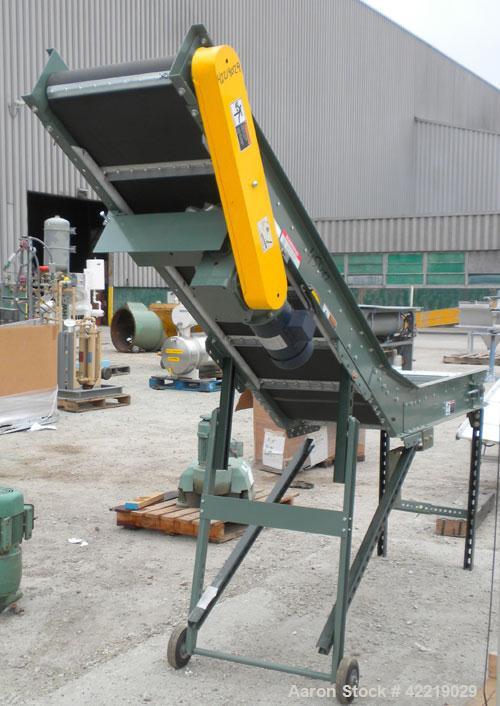 Used Hytrol Inclined Belt Conveyor, carbon steel. 18" wide x 48" long horizontal section x 72" long inclined section. 12" long pockets. 38" Load height, 80" discharge height. Driven by a 1/2 hp, 90 v...