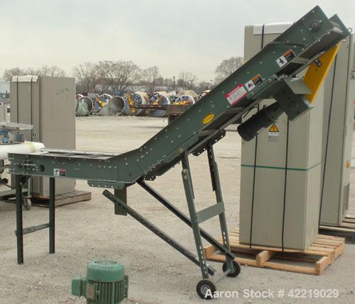 Used Hytrol Inclined Belt Conveyor, carbon steel. 18" wide x 48" long horizontal section x 72" long inclined section. 12" long pockets. 38" Load height, 80" discharge height. Driven by a 1/2 hp, 90 v...