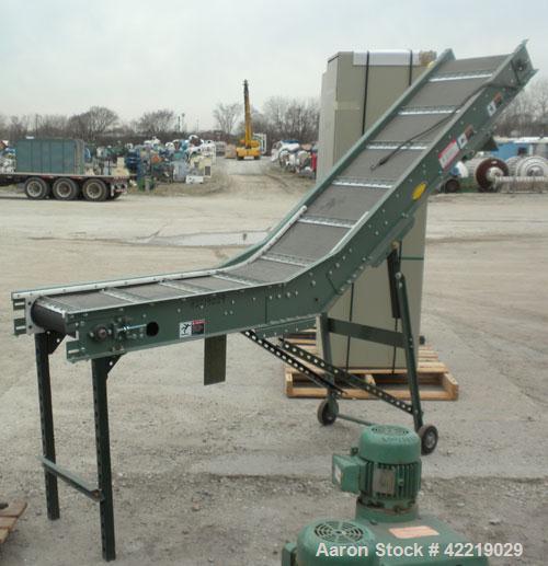 Used Hytrol Inclined Belt Conveyor, carbon steel. 18" wide x 48" long horizontal section x 72" long inclined section. 12" long pockets. 38" Load height, 80" discharge height. Driven by a 1/2 hp, 90 v...
