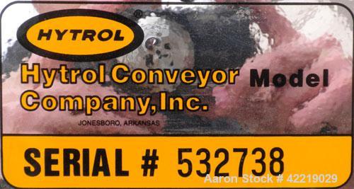 Used Hytrol Inclined Belt Conveyor, carbon steel. 18" wide x 48" long horizontal section x 72" long inclined section. 12" long pockets. 38" Load height, 80" discharge height. Driven by a 1/2 hp, 90 v...