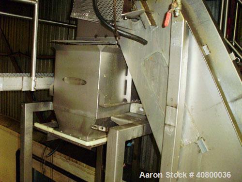 Used Inclined Plastic Belt Conveyor. 18" wide x 96" long with 9" wide x 3" tall off set pockets. 301 stainless steel supply feed hopper, 64" wide x 56" long x approximately 56" deep. Driven by an app...