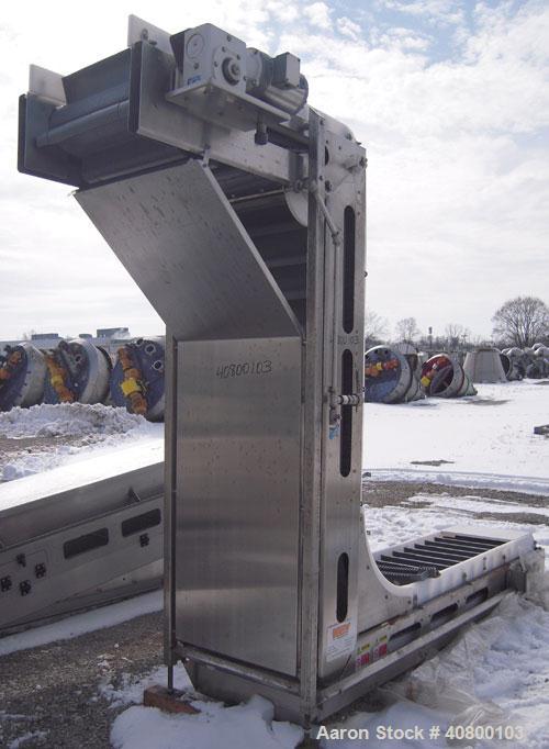 Unused- Key Technology Intralox Belt Conveyor, Model 435561, 304 stainless steel. Plastic belt with 4" flights on 6" centers, 24" wide (21 7/8" wide conveying width) x 84" horizontal bottom section x...