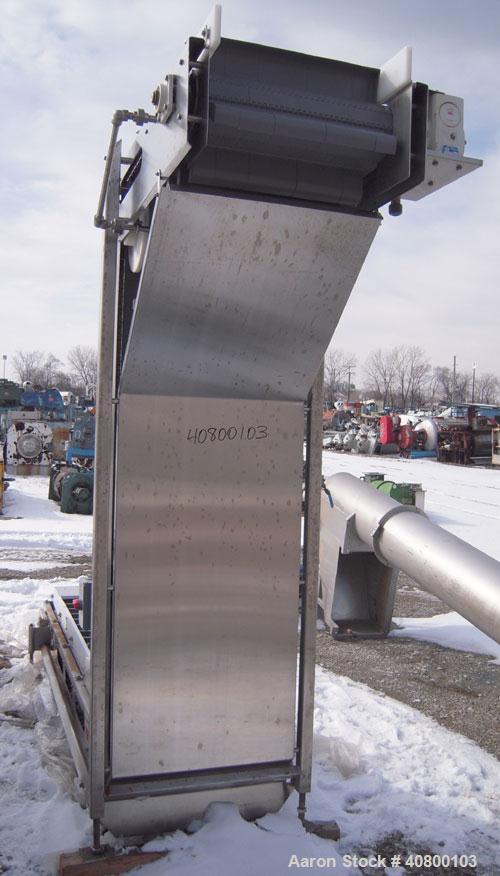 Unused- Key Technology Intralox Belt Conveyor, Model 435561, 304 stainless steel. Plastic belt with 4" flights on 6" centers, 24" wide (21 7/8" wide conveying width) x 84" horizontal bottom section x...