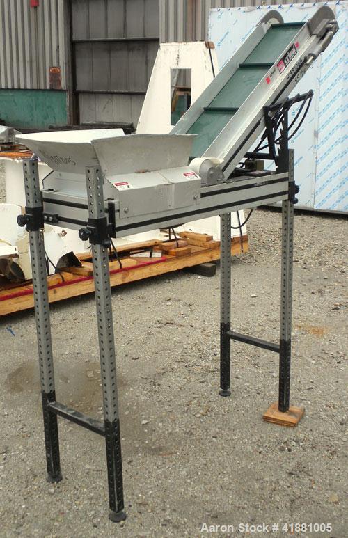 Used Crizaf Incline Belt Conveyor, Model LTCH/1-0510. 10" wide x 12" horizontal section x 40" incline section. Driven by a 1/6 hp, 1/60/115 volt, 40 rpm gear motor, ratio 42.7:1. Approximate 70" disc...