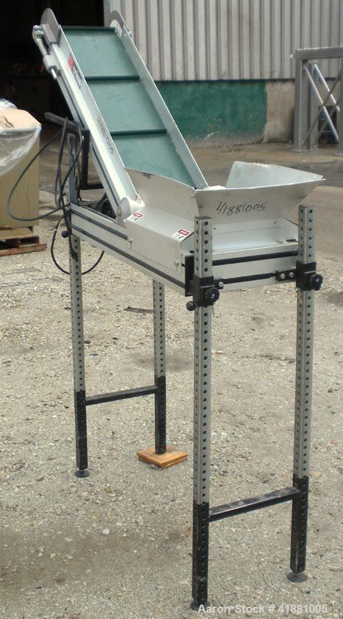 Used Crizaf Incline Belt Conveyor, Model LTCH/1-0510. 10" wide x 12" horizontal section x 40" incline section. Driven by a 1/6 hp, 1/60/115 volt, 40 rpm gear motor, ratio 42.7:1. Approximate 70" disc...